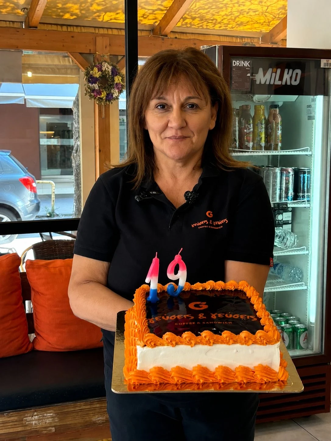 The owner of Geuseis & Geuseis celebrating the shop’s 19th anniversary